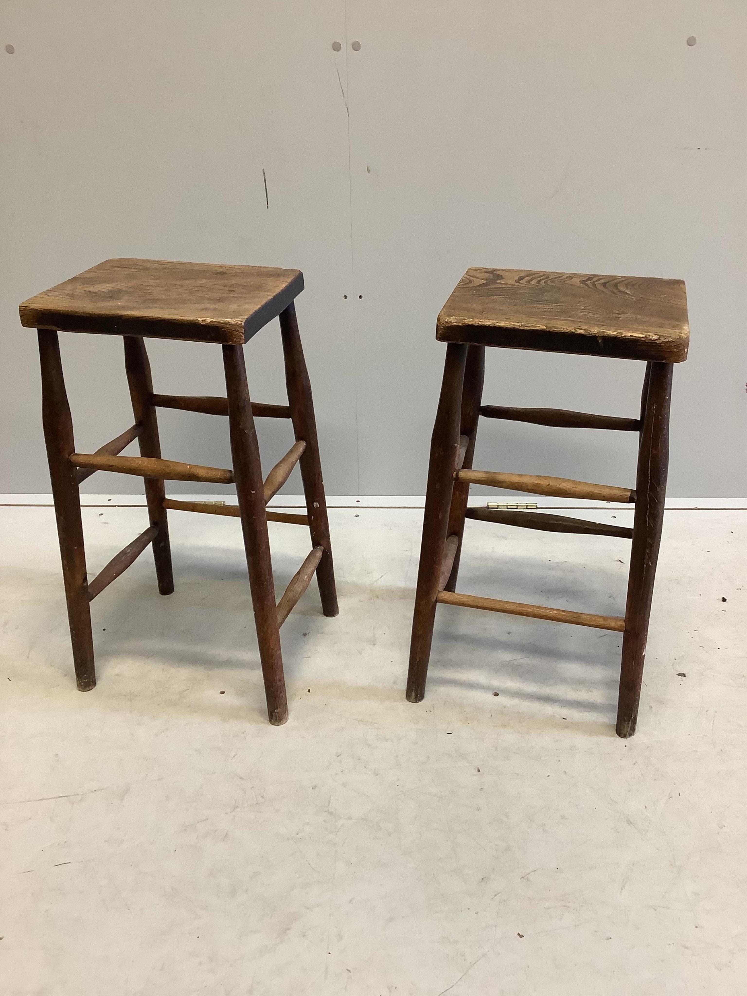 A pair of Victorian elm and beech stools, width 31cm, depth 25cm, height 62cm. Condition - poor, one stretcher missing